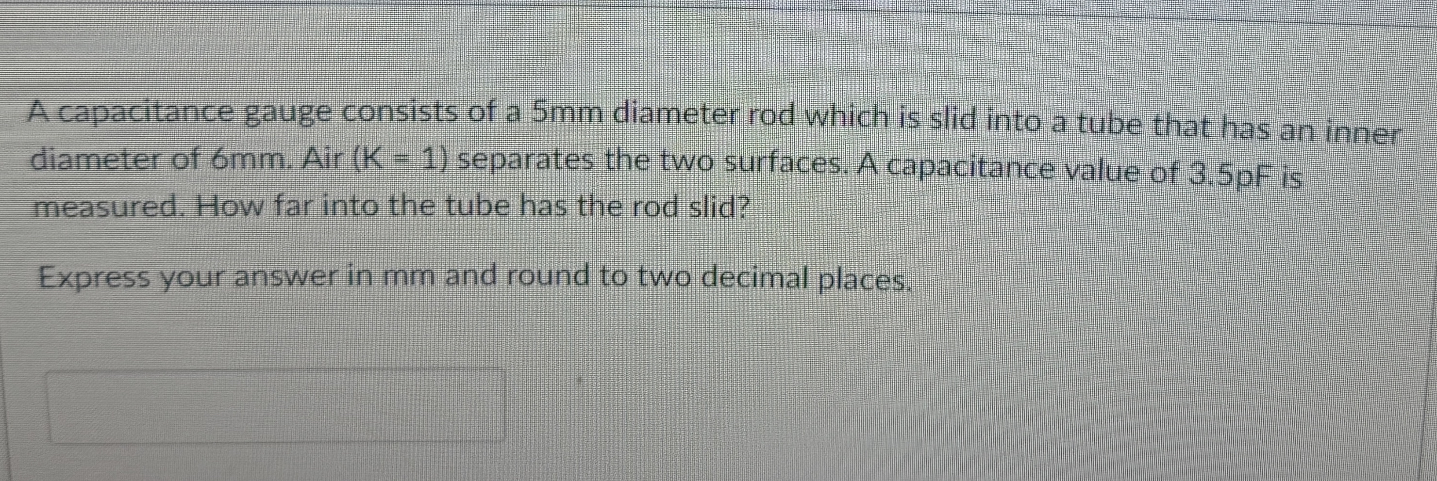 A capacitance gauge consists of a 5 mm diameter