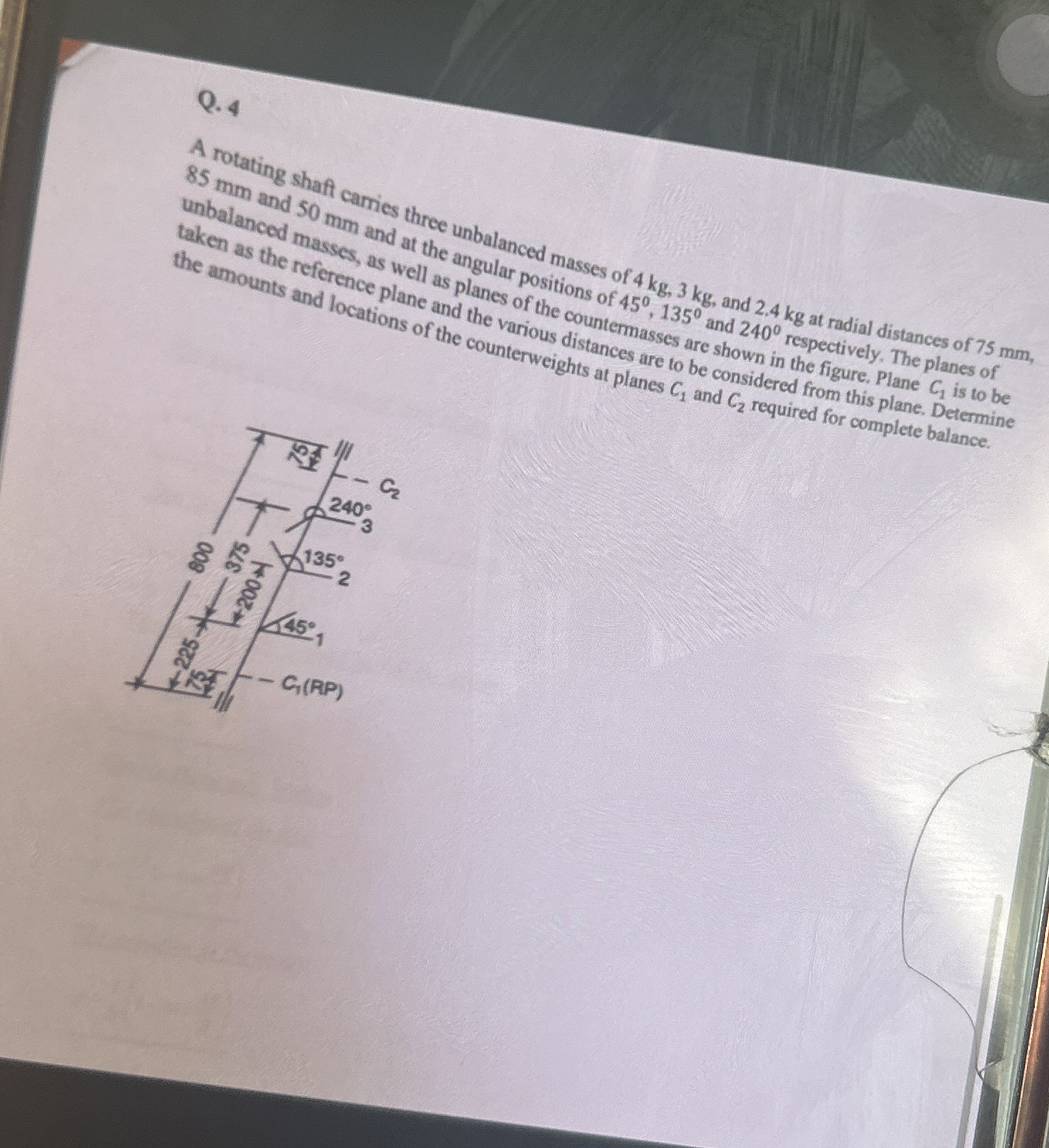 Q . 4 A rotating shaf camies three unbalanced