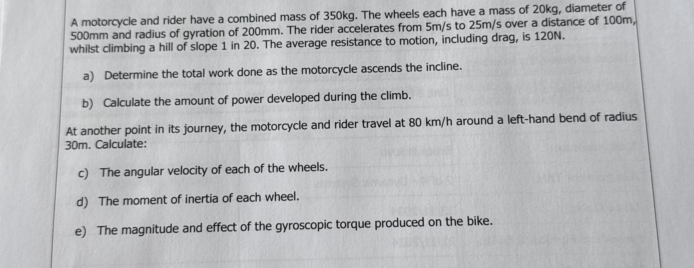 A motorcycle and rider have a combined mass of 3