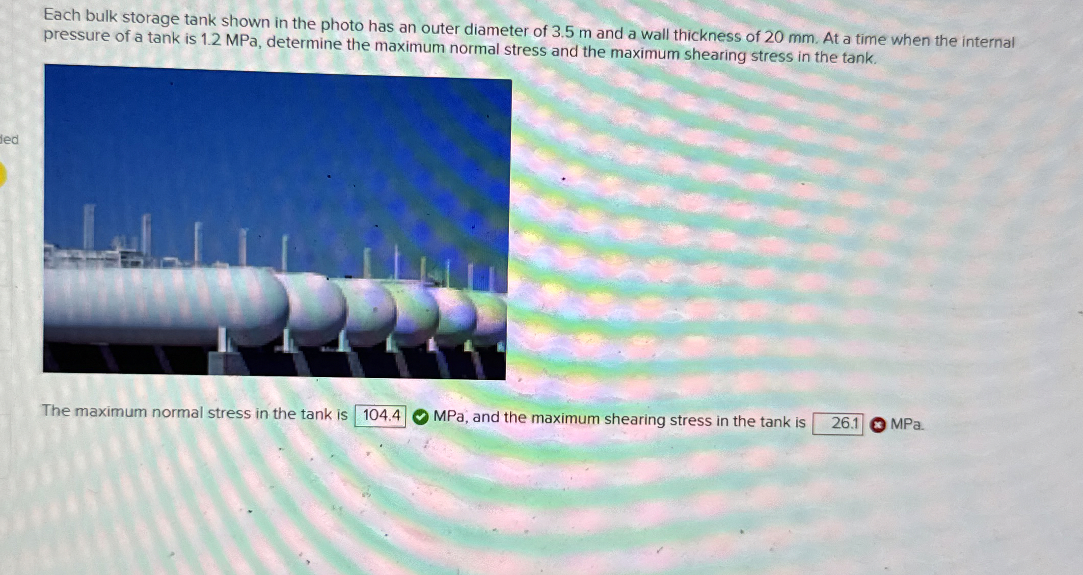 Each bulk storage tank shown in the photo has an