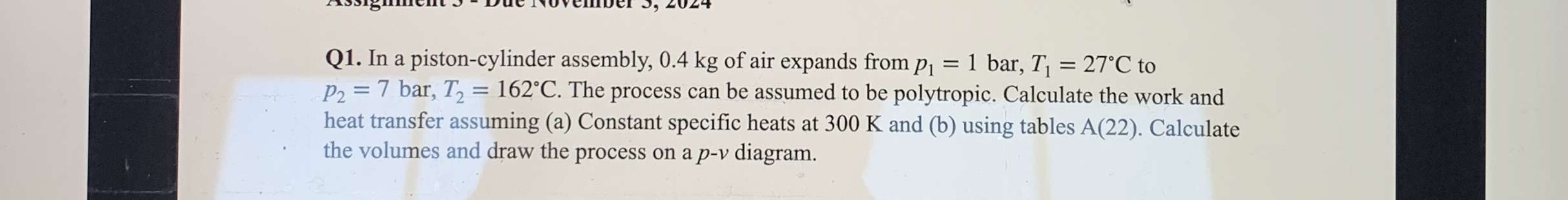 Q 1 . In a piston - cylinder assembly, 0 . 4 kg