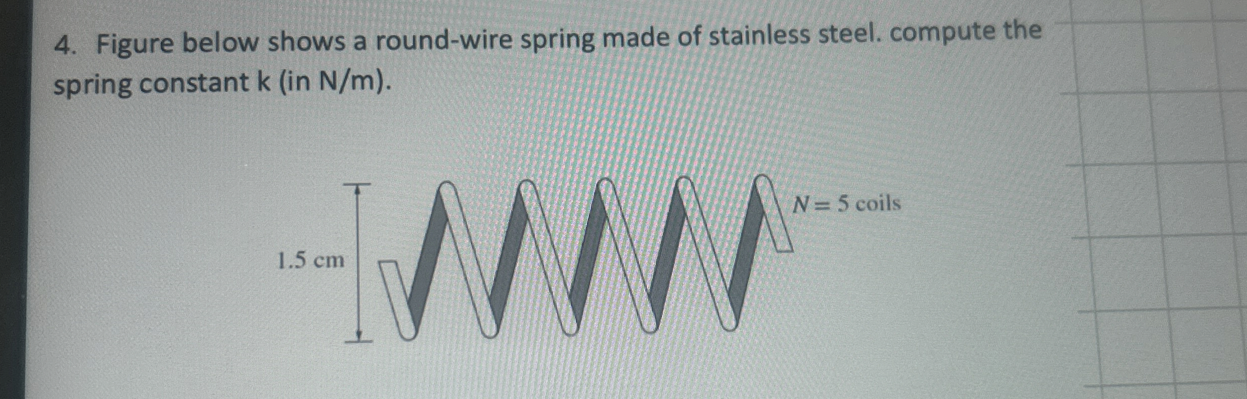Figure below shows a round - wire spring made of