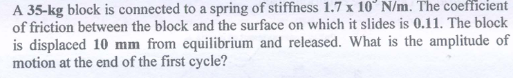 A 3 5 - kg block is connected to a spring of