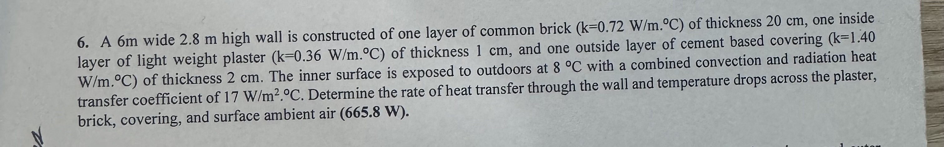 A 6 m wide 2 . 8 m high wall is constructed of