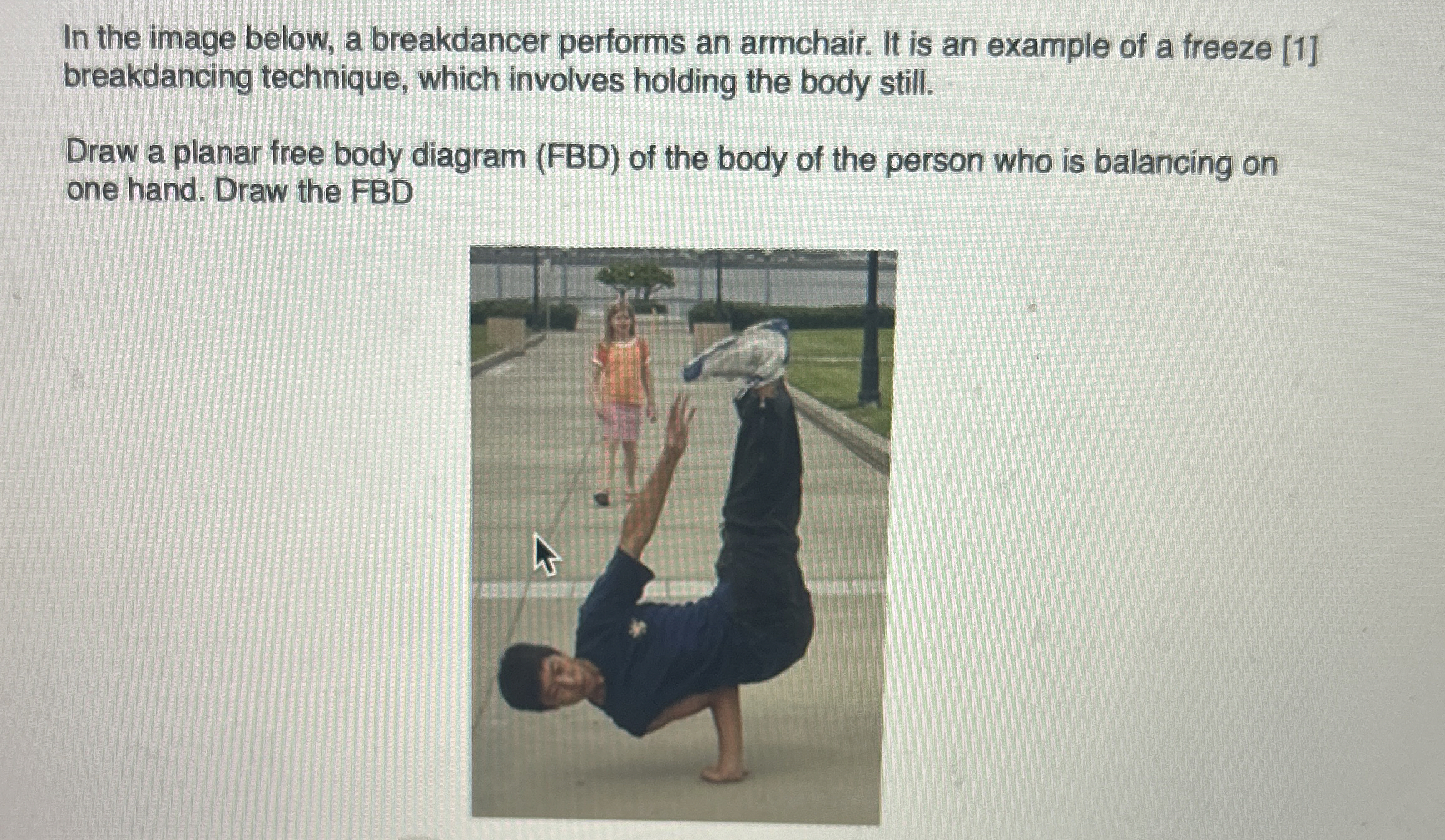 In the image below, a breakdancer performs an