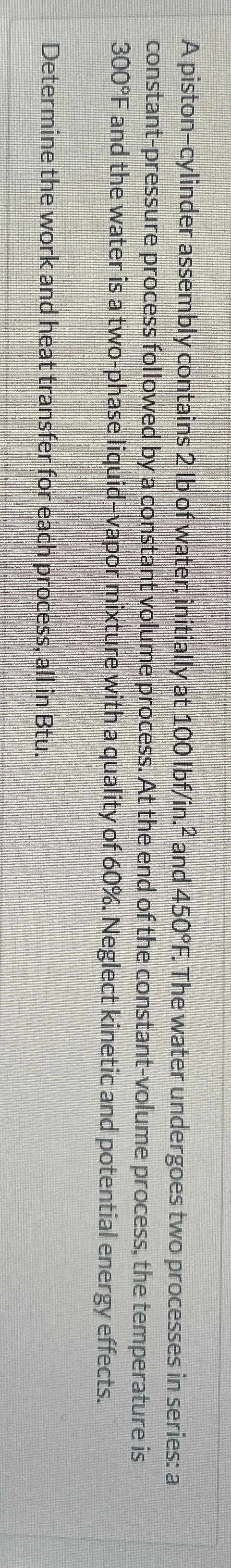A piston - cylinder assembly contains 2 lb of