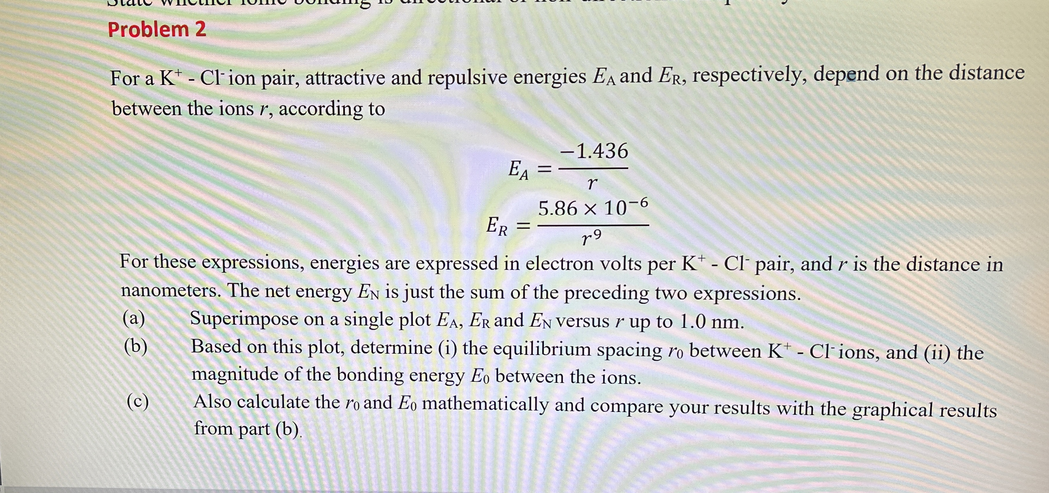 Problem 2 For a K + - C l - ion pair, attractive