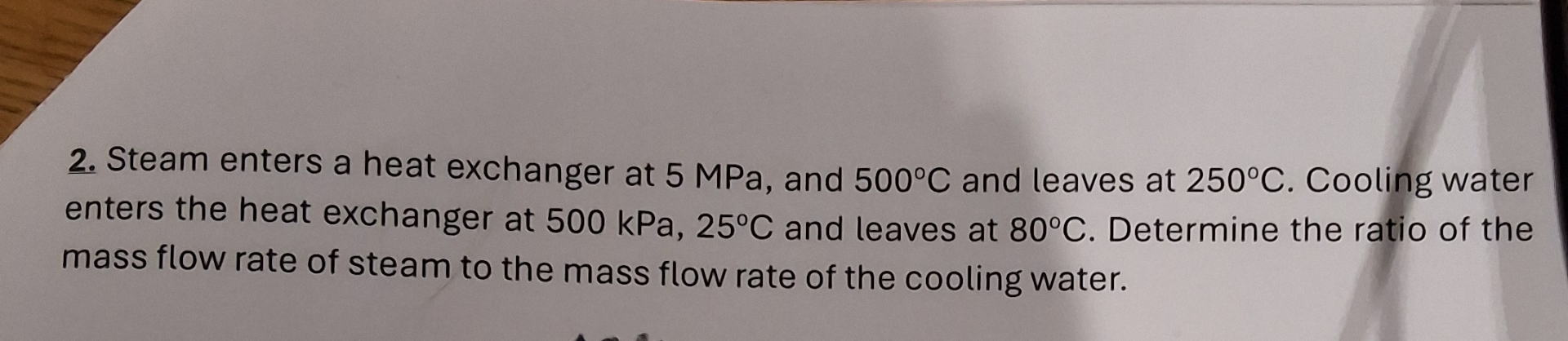 Steam enters a heat exchanger at 5 MPa , and 5 0