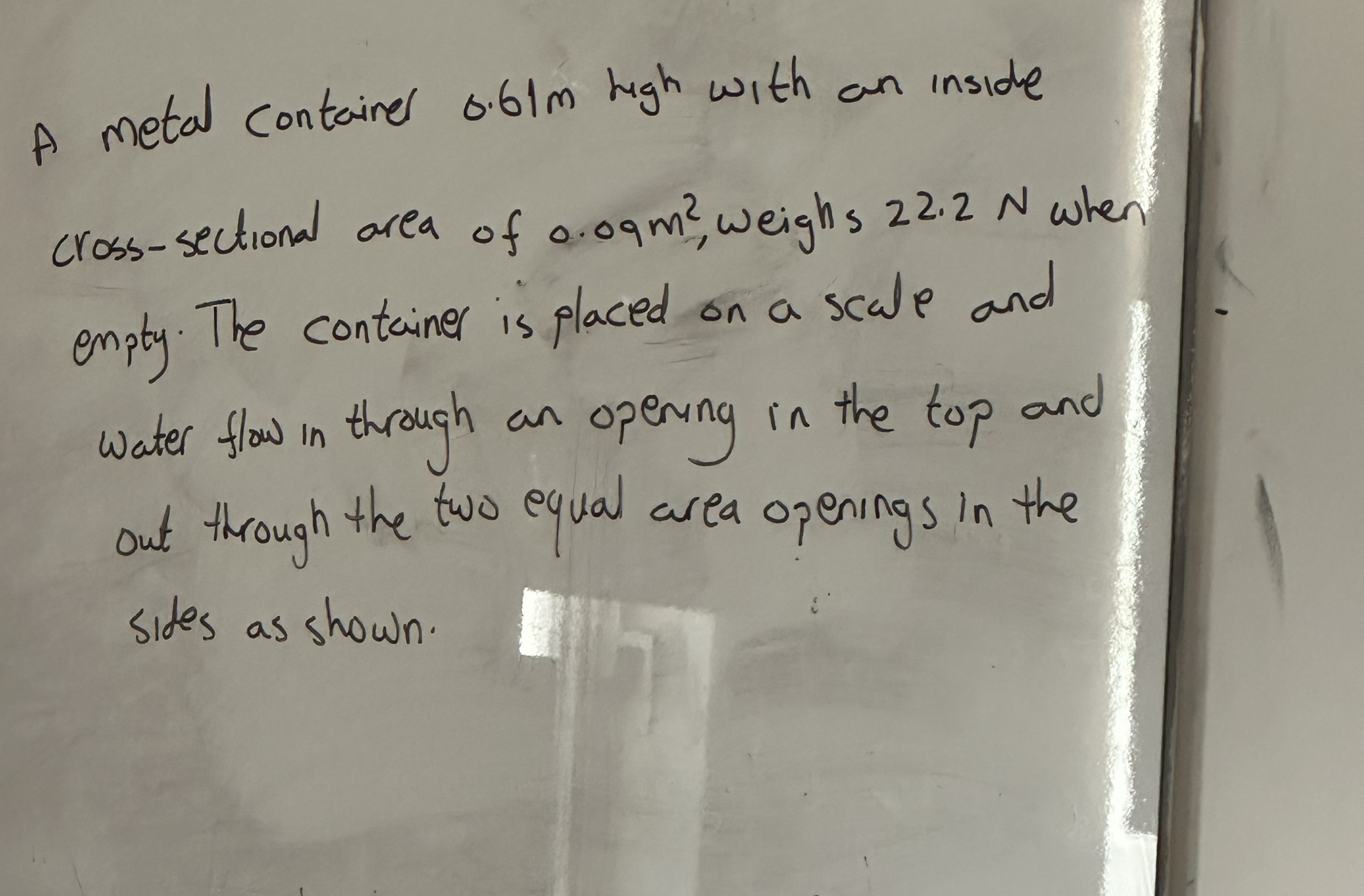 A metal containes 0 . 6 1 m high with an inside