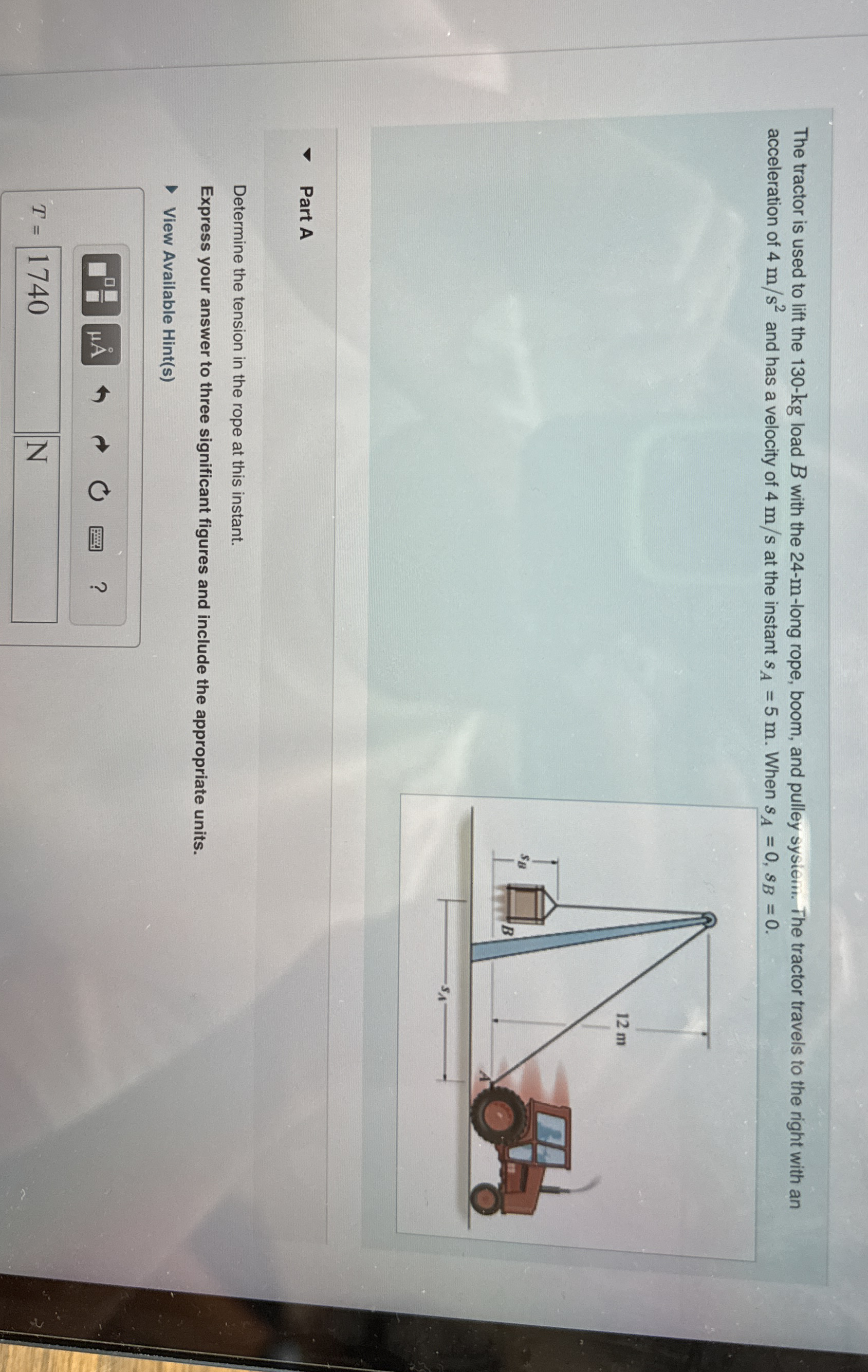 The tractor is used to lift the 1 3 0 - k g load