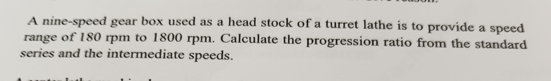 A nine - speed gear box used as a head stock of a