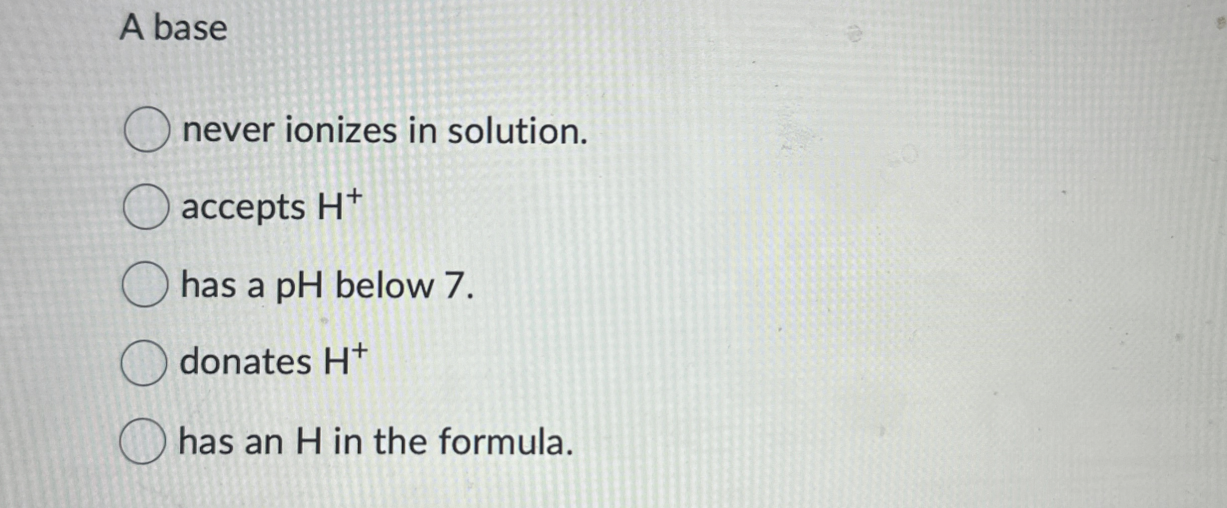 A base never ionizes in solution. accepts H + has