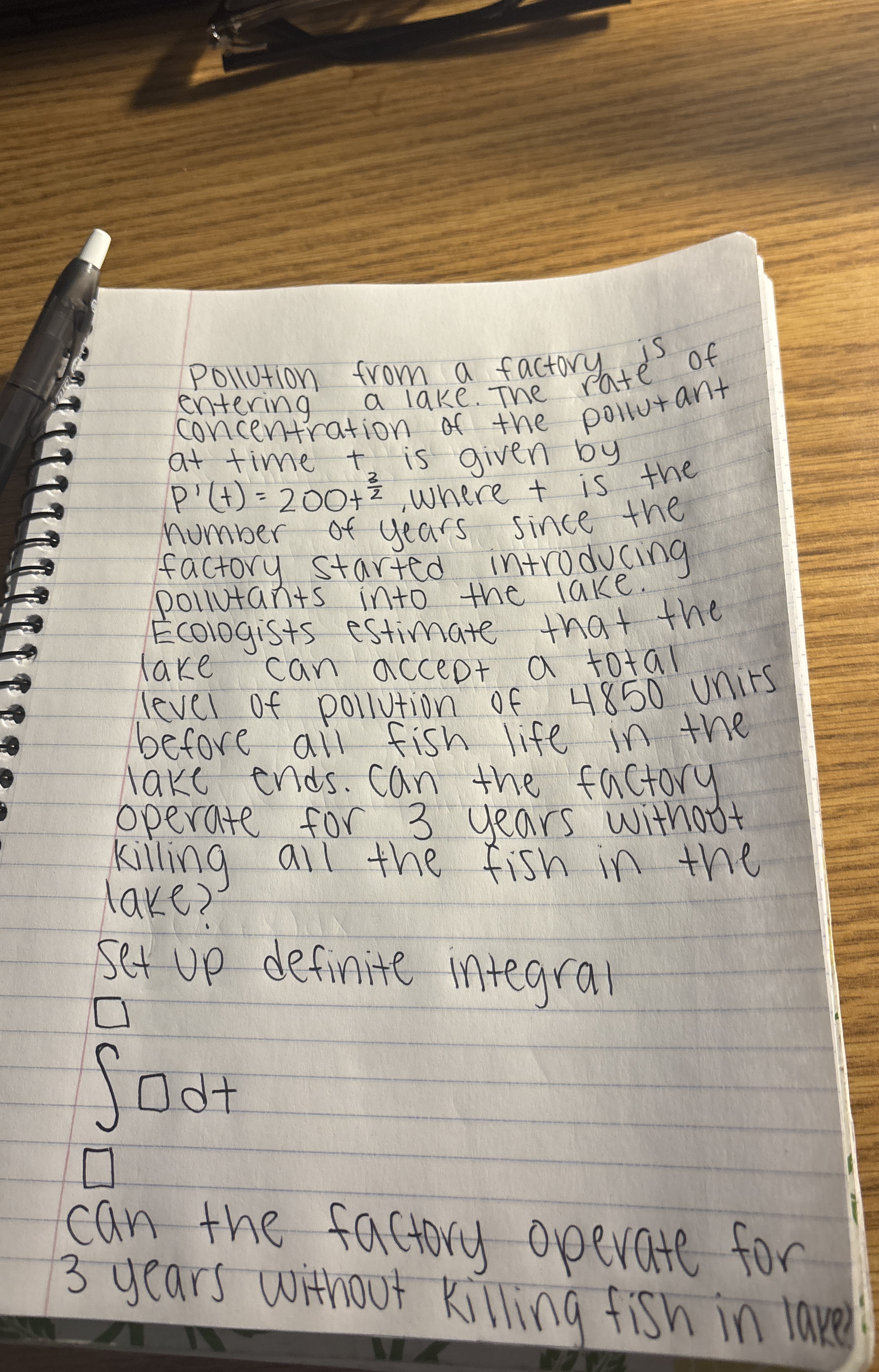 Pollution from a factory antering a lake. The at