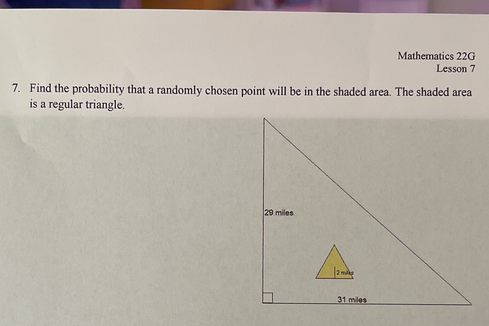It says "2 miles" in the yellow triangle of its
