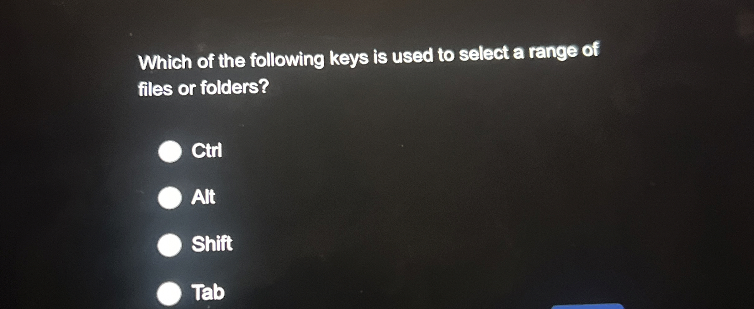 Which of the following keys is used to select a