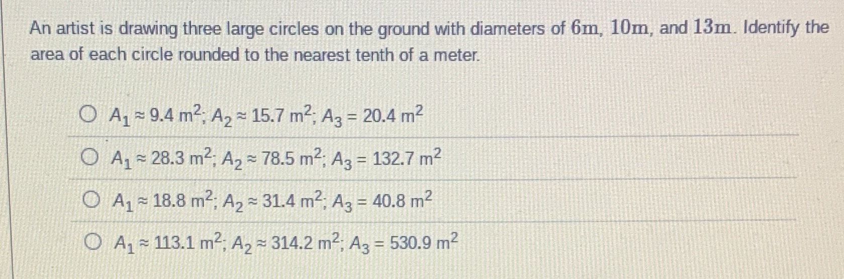 An artist is drawing three large circles on the