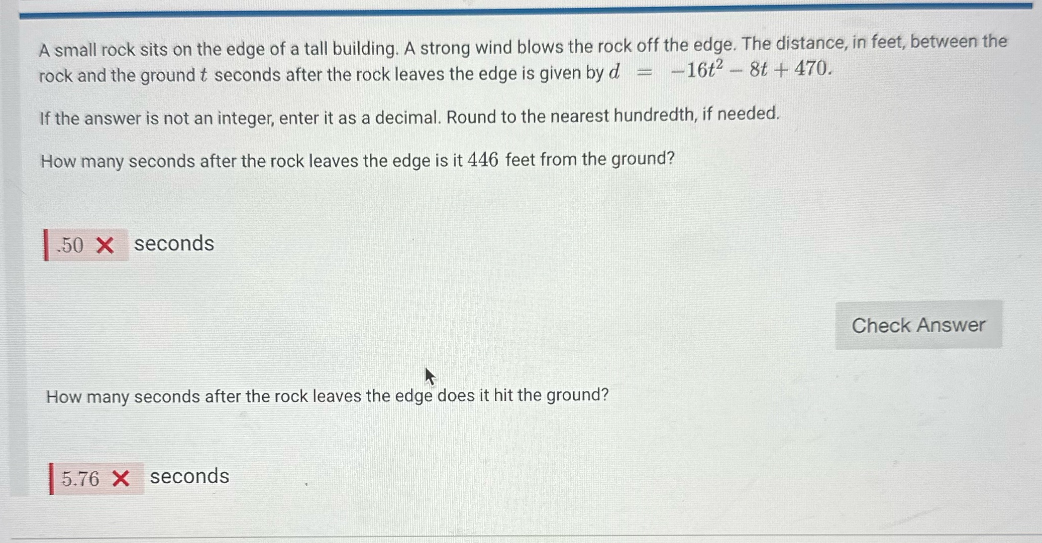 A small rock sits on the edge of a tall building.
