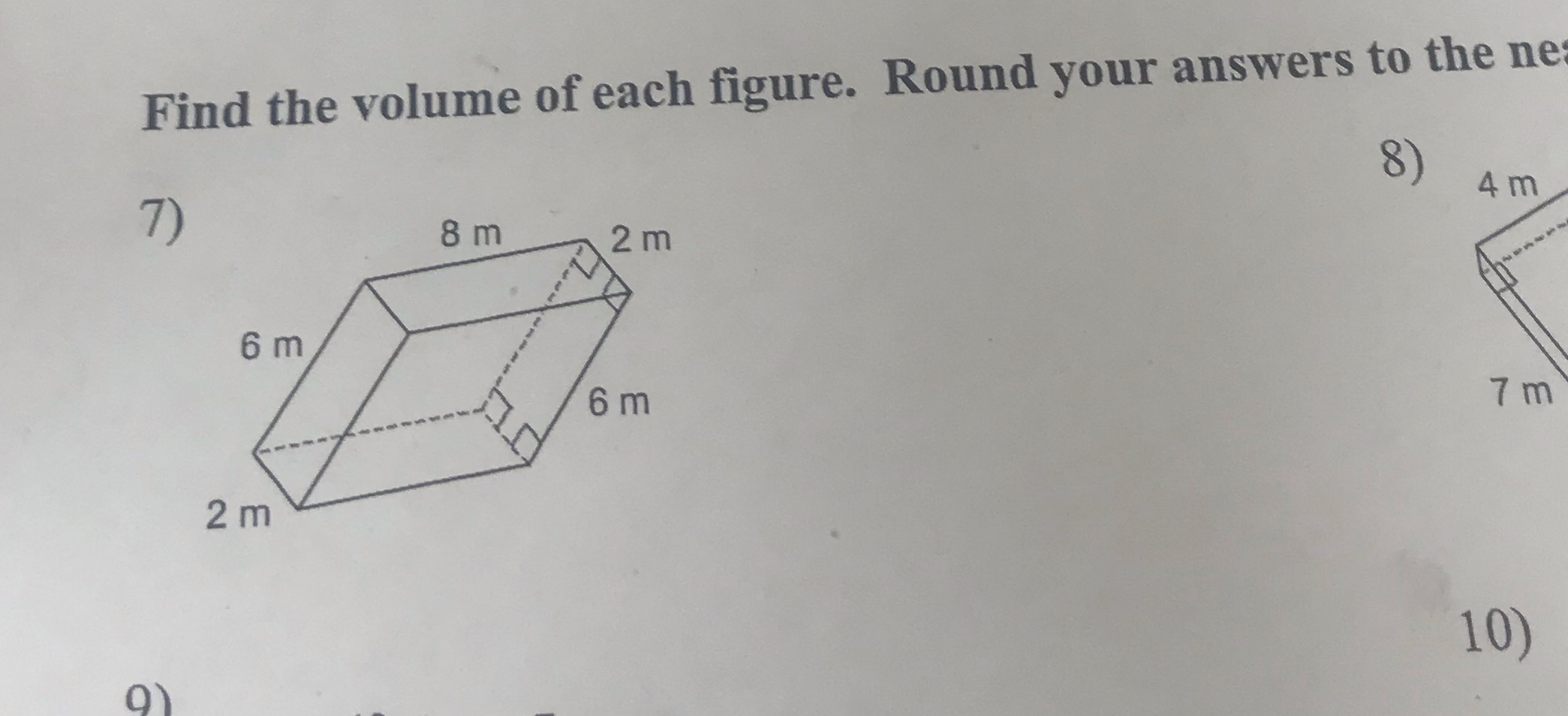 Find the volume of each figure . Round your