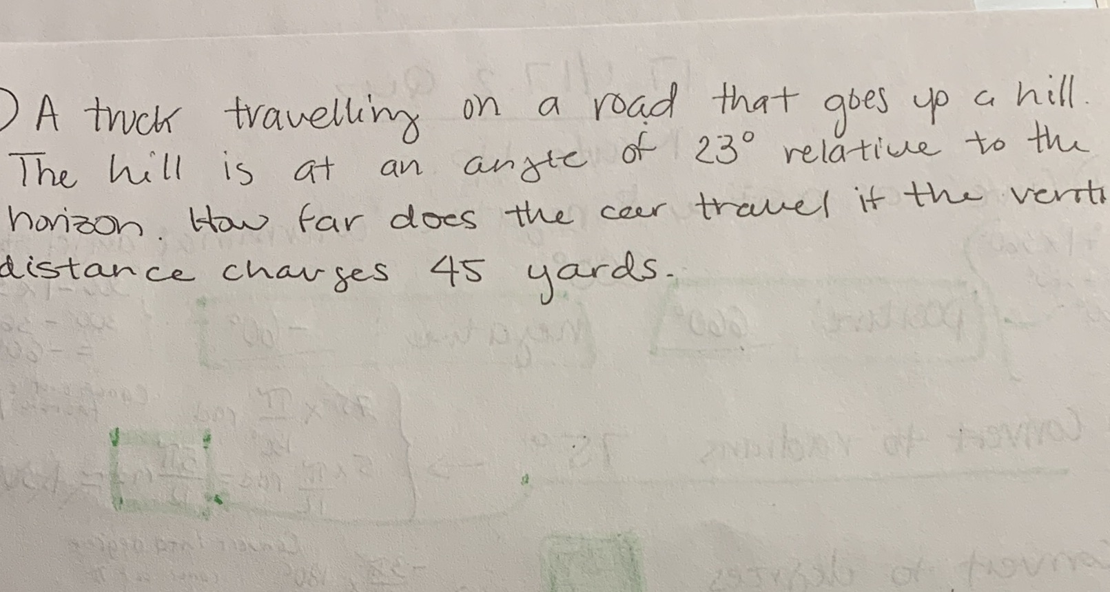 ) A truck travelling on a road that goes up a