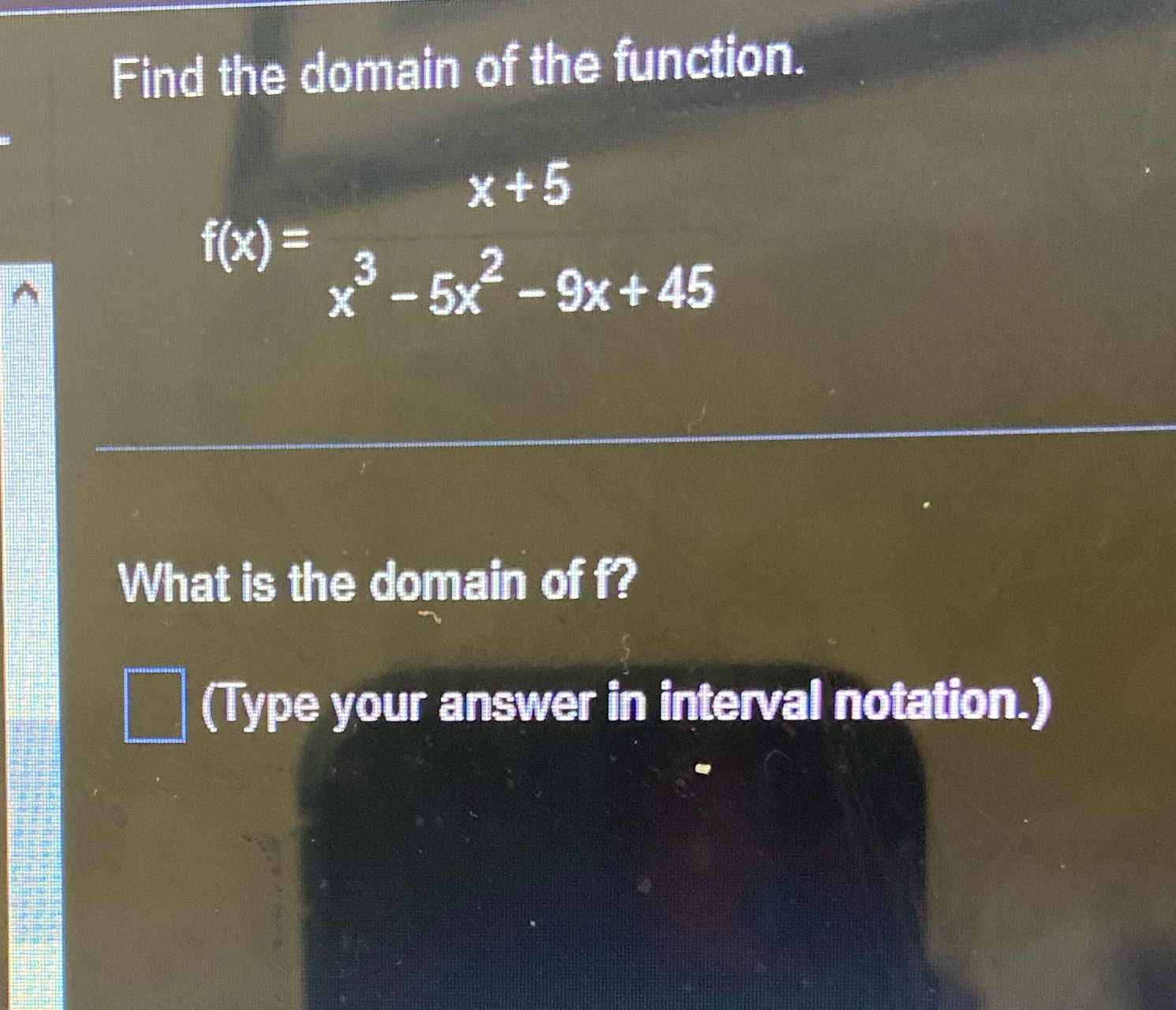 Find the domain of the function. x+5 f(x) = - 5x-