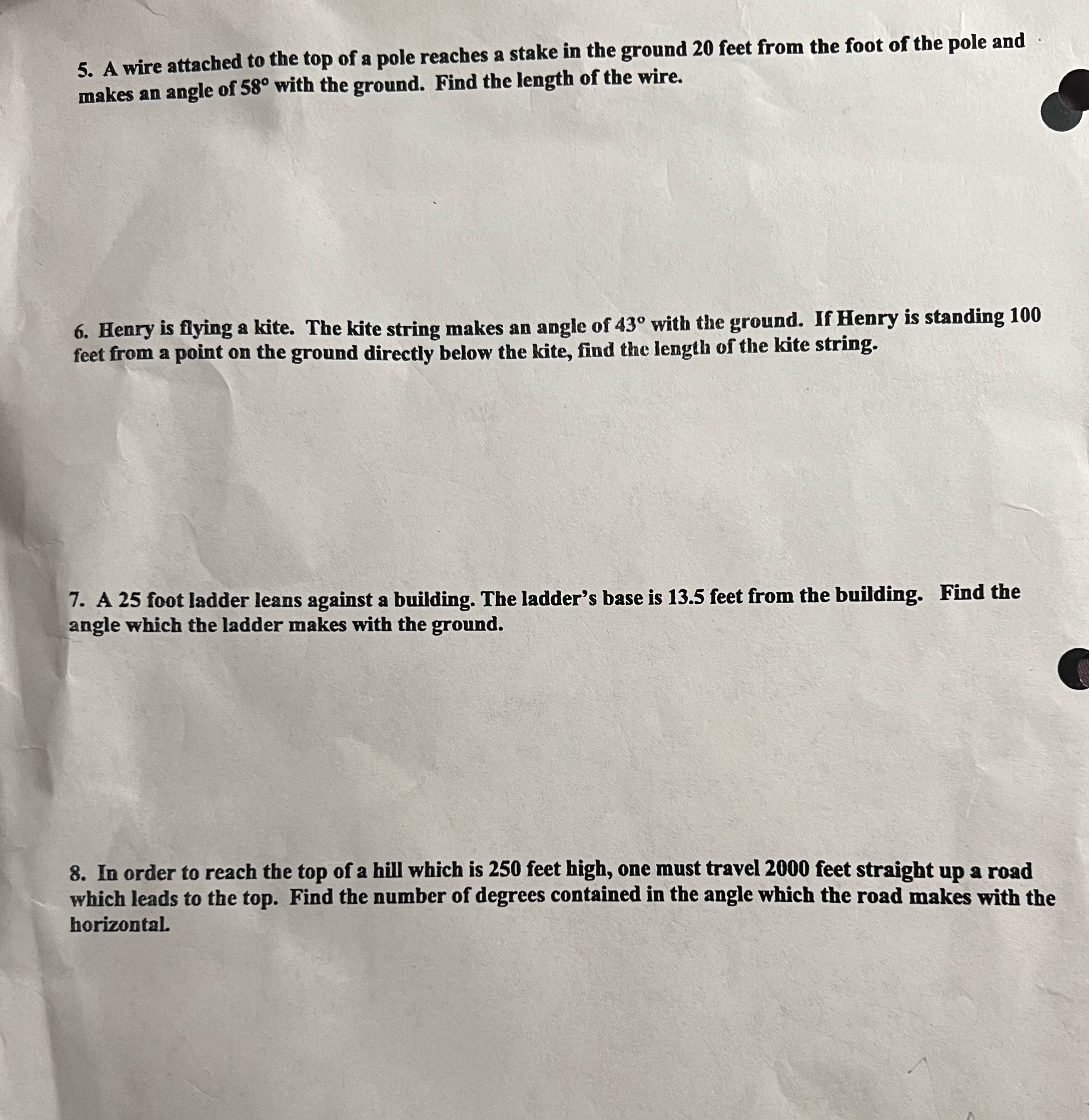 5. A wire attached to the top of a pole reaches a