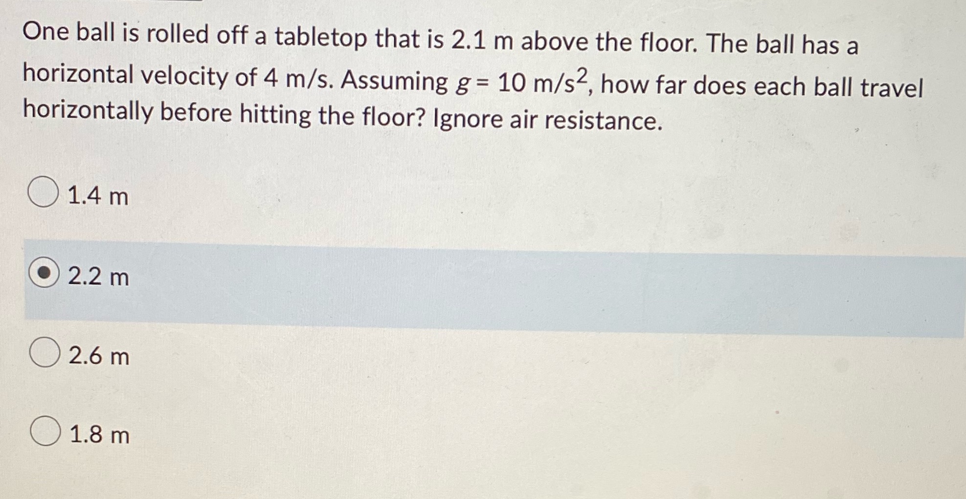 One ball is rolled off a tabletop that is 2.1 m