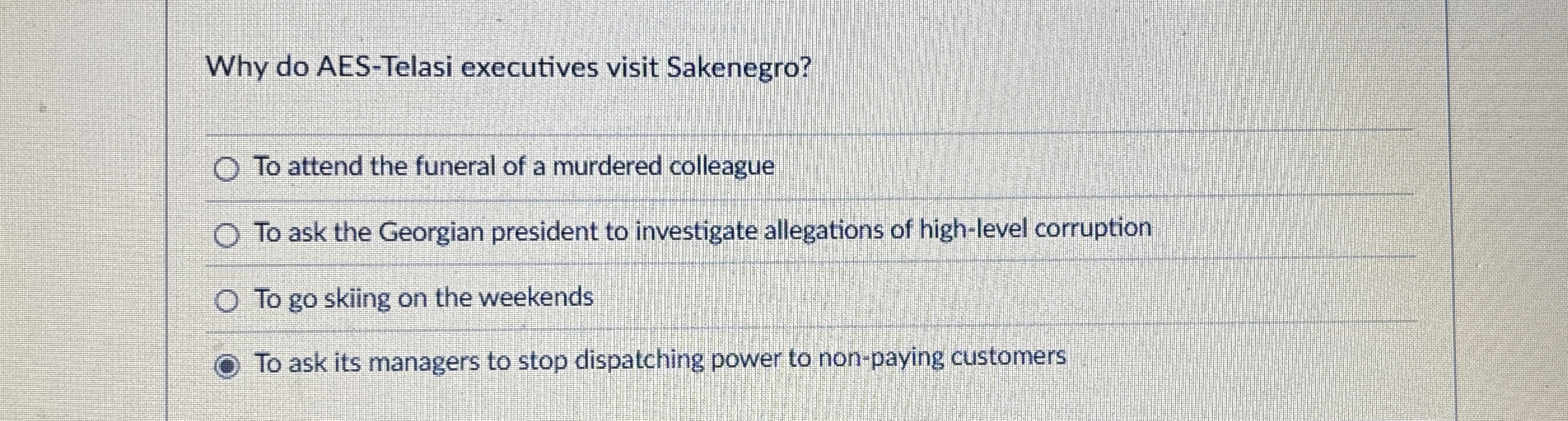 Why do AES - Telasi executives visit Sakenegro?