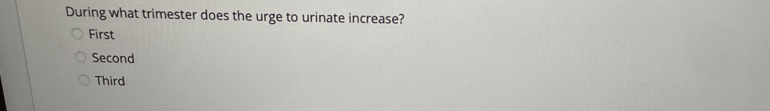 During what trimester does the urge to urinate