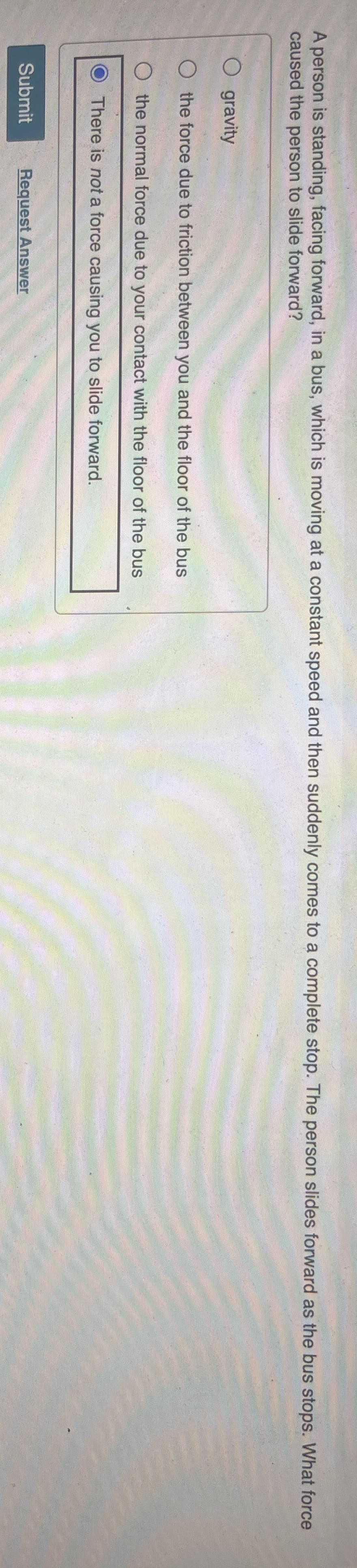 A person is standing, facing forward, in a bus,