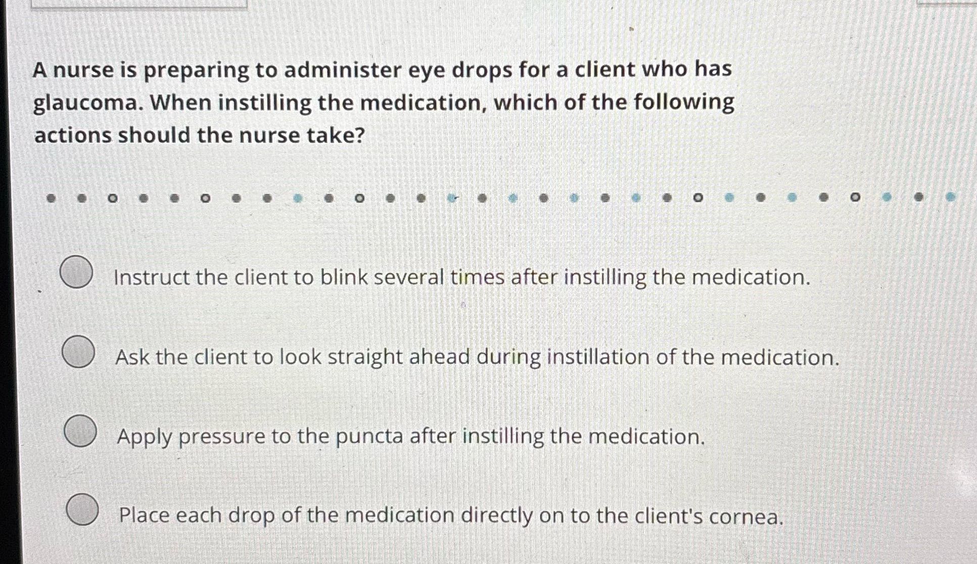 A nurse is preparing to administer eye drops for