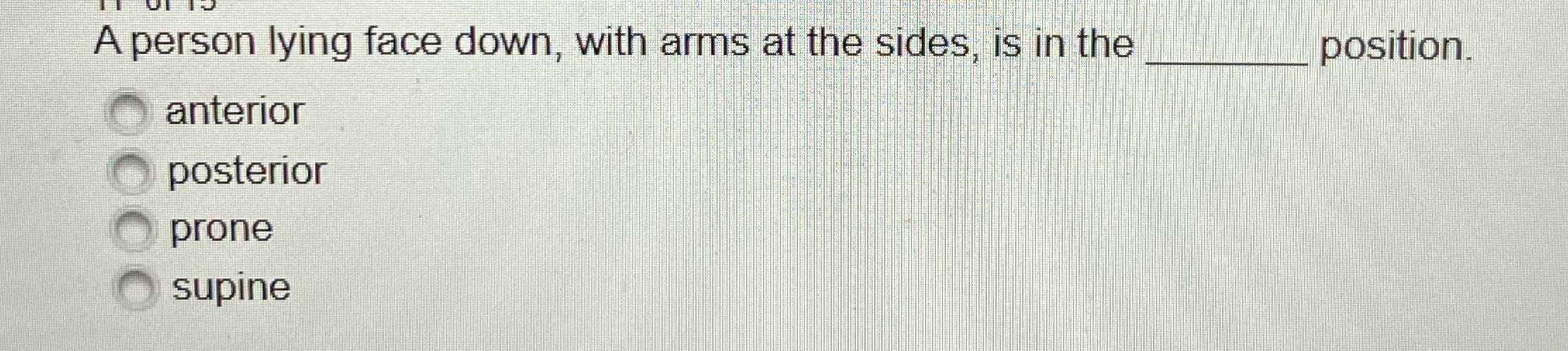 A person lying face down, with arms at the sides,