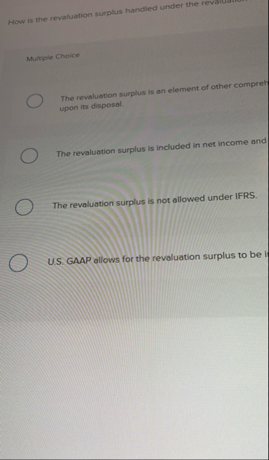 How is the revaluation surplus handled under the