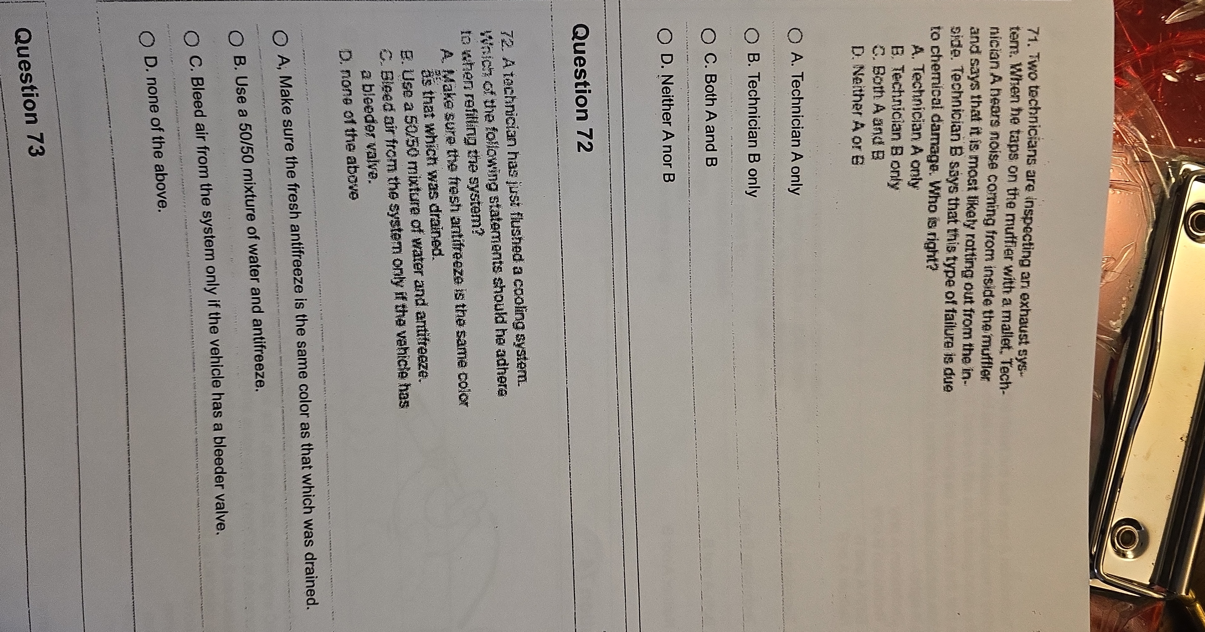 O 71. Two technicians are inspecting an exhaust