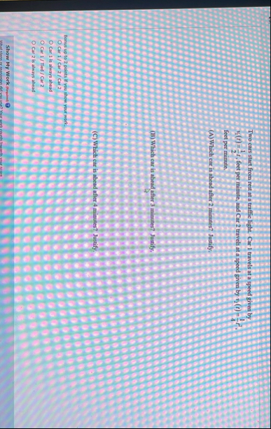 Two cars start from rest at a traffic light. Car