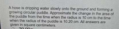 A hose is dripping water slowly onto the ground