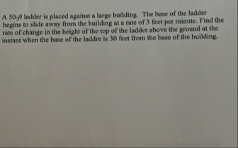 A 5 0 % l ladder is placed against a large