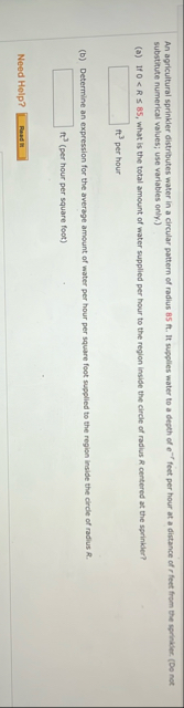 An agricultural sprinkler distributes water in a