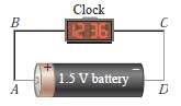 A battery is connected to a clock by copper wires