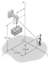 To lift a heavy crate, a man uses a block