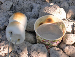 A paper cup placed among hot coals will burn if