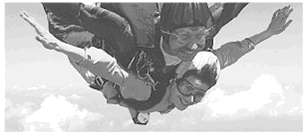 (a) What is the acceleration of two falling skydivers (mass