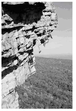Two rock climbers, Bill and Karen, use safety ropes of