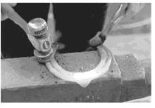 A hot iron horseshoe (mass = 0.40kg), just forget (Fig.