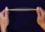 Stretch a rubber band between your two thumbs, and pluck