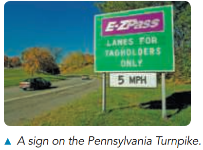 E-ZPass LANES FOR TAGHOLDERS ONLY 5 MPH A sign on the Pennsylvania Turnpike. 
